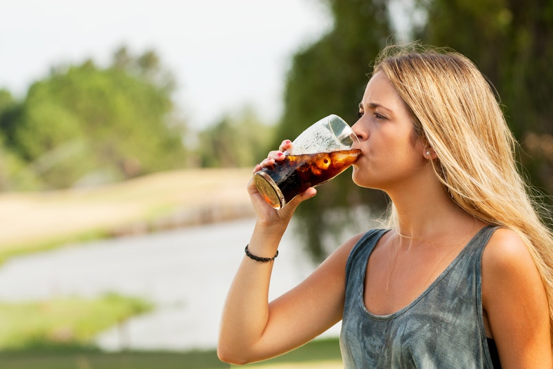 Teen drinking cola